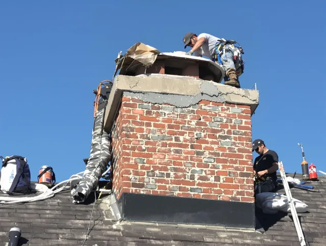 Riverside Chimney Sweep installing a custom chimney crown in Riverside, CA