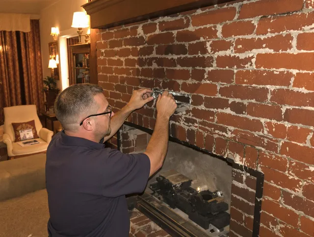 Riverside Chimney Sweep expert fixing a fireplace in Riverside, CA
